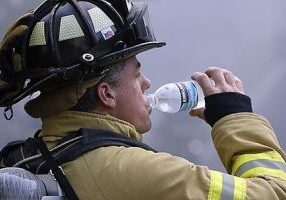 20080719FC  8/x  A firefighter drinks water while taking a break from battling a townhouse fire on Fox Chase Lane in Hanover, on Saturday July 19, 2008.  Three of the six units were destroyed and the others had smoke and water damage.  One firefighter was taken to an area hospital.  Fire departments from seven towns and the county responded to the fire that was called in by a neighbor.  HANOVER, NJ  7/19/08  3:48:47 PM  FRANK H. CONLON/THE STAR-LEDGER

 Moved to Selects: 07/19/08 17:33:25, Carla